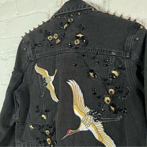 Black denim Jean jacket with custom patches and hand beaded.
